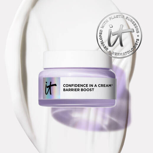 IT Cosmetics Confidence in a Cream Barrier Boost moisturizer jar on cream texture background, developed with dermatologists.