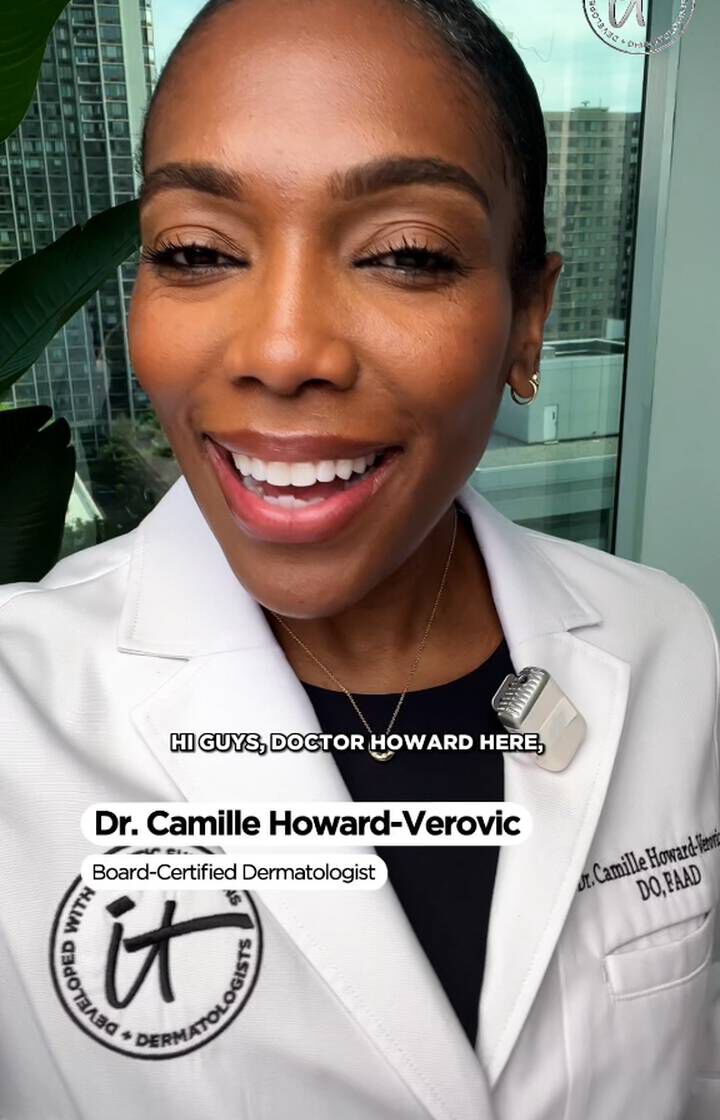 Dr. Camille Howard-Verovic, board-certified dermatologist, smiling in a white coat during a video message in a bright room.