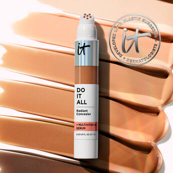 IT Cosmetics Do It All Radiant Concealer with Multivitamin Serum displayed over swatches of multiple skin tone shades.